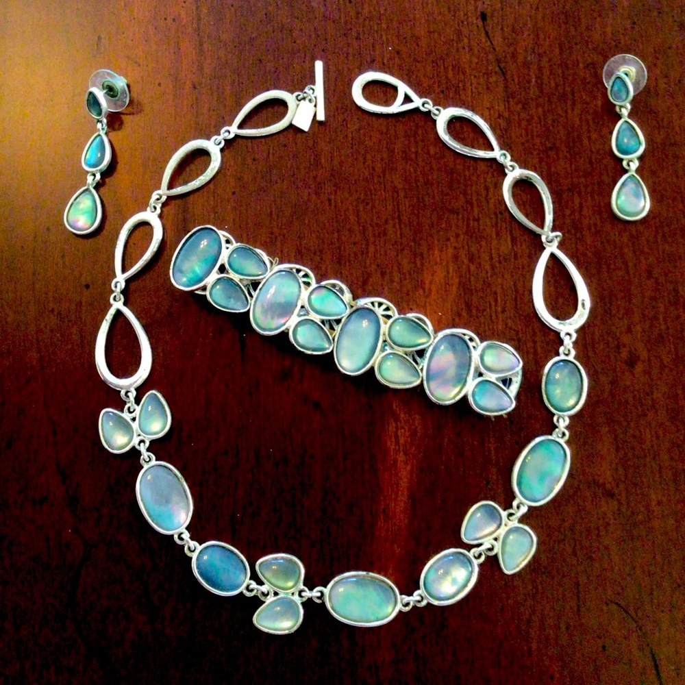 Jewelry set, light blue with opal-like hues.